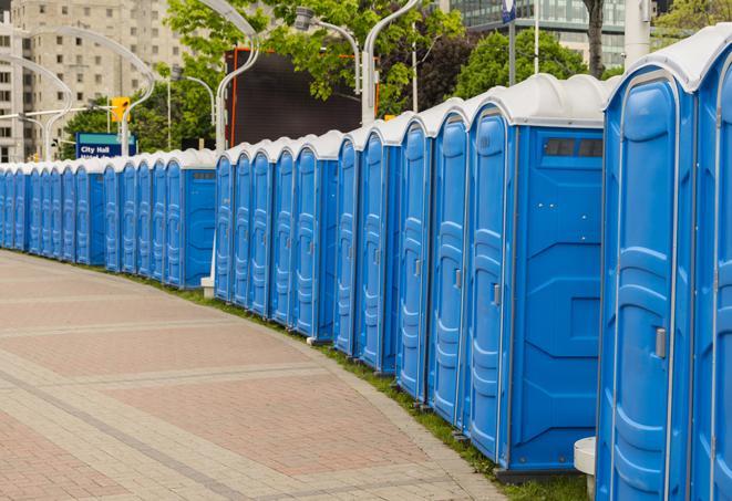 a row of portable restrooms at a fairground, offering visitors a clean and hassle-free experience in warracres